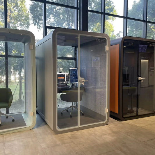 An employee finding solace in an office phone booth, representing a peaceful retreat amidst the open office chaos, highlighting mental health benefits.