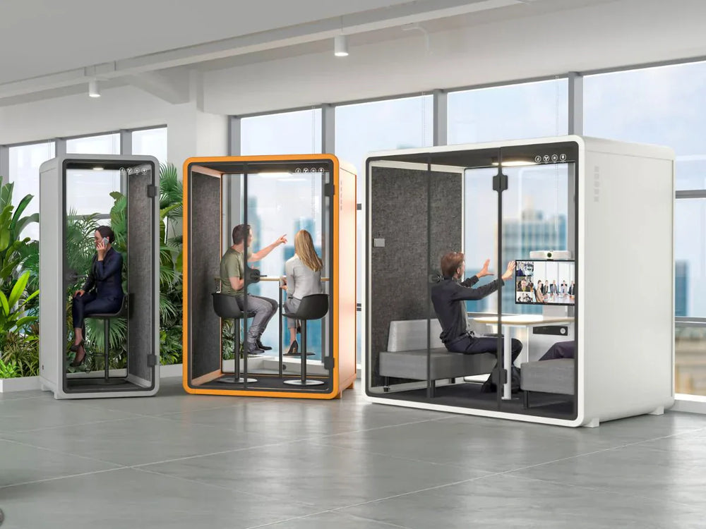 Different sizes of acoustic privacy pods in coworking office