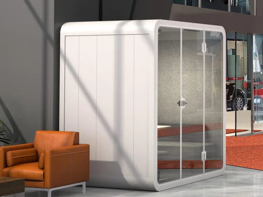 A modern office equipped with various privacy-enhancing solutions, including soundproof pods and privacy screens, to protect confidential information.