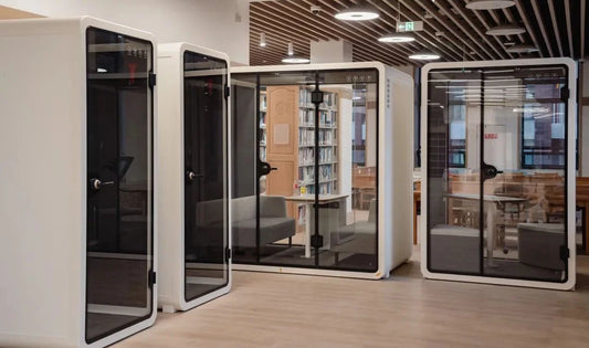 An office layout with PrivacyPod.ai's sleek office pods, promoting productivity and employee well-being.