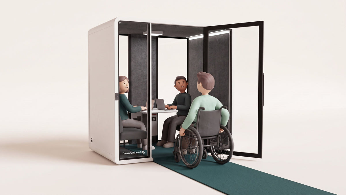 Illustration of a person in a wheelchair rolling along a green runner into the wide open door of an accessible meeting pod, the runner continuing flat inside with no step, where two colleagues at a desk look up to welcome them.