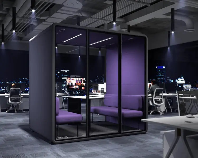Modern glass-walled office pod with purple seating and night city view