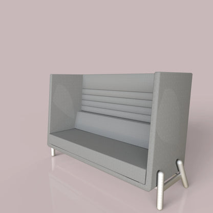 Modern gray lounge sofa with high backrest and minimalist design on a pink background.