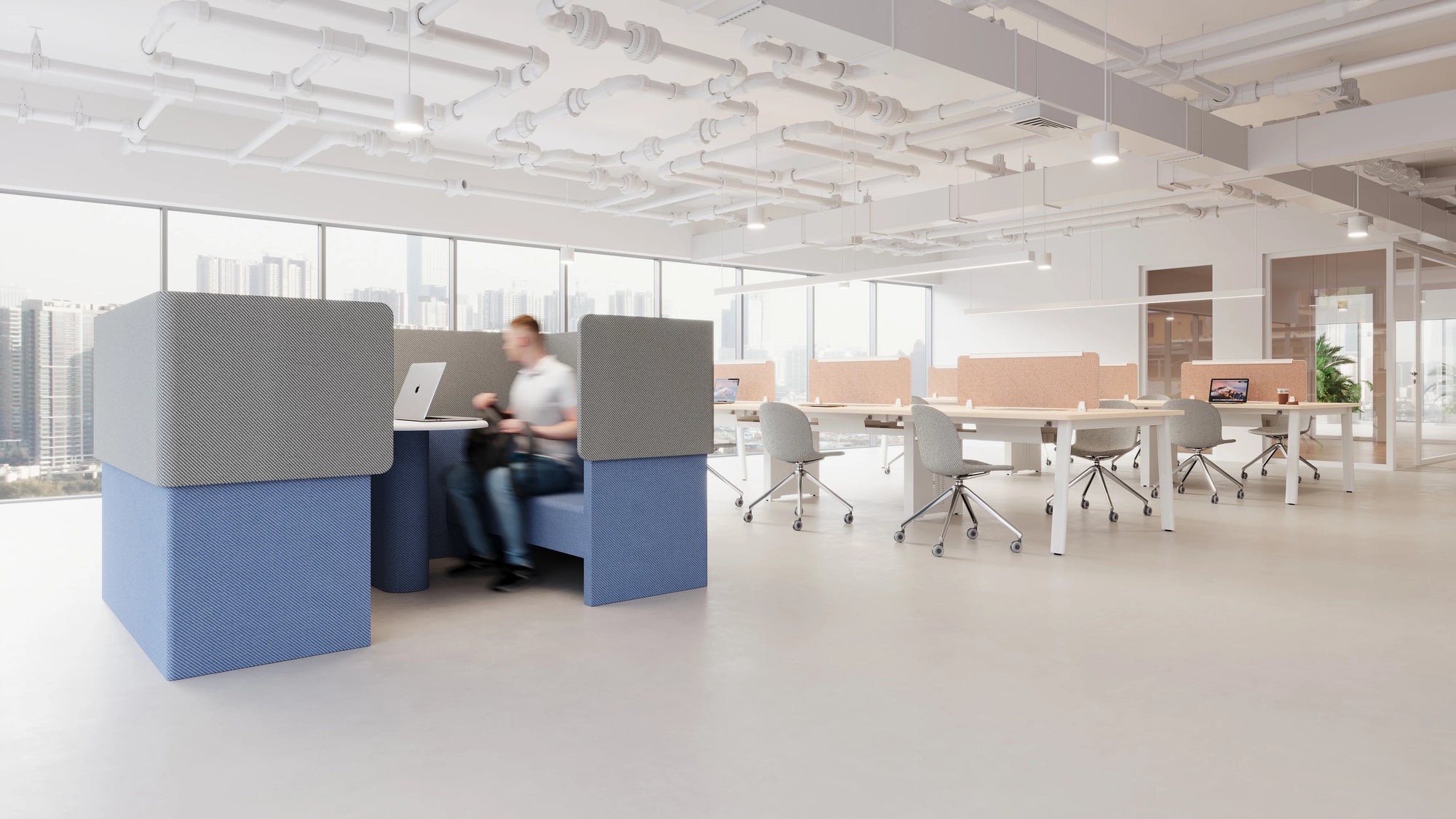 Modern open-plan office space with private booths and desks, featuring a bright and minimalistic design with city views in the background.
