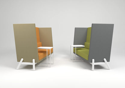 Modern office seating with high-back orange and green booth-style chairs and white side tables on a minimalist background.