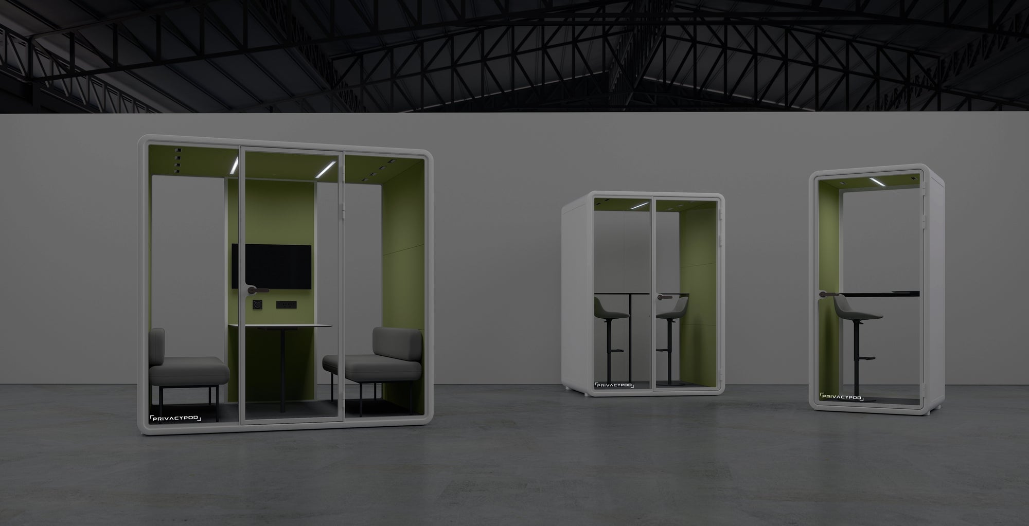 Three modern privacy pods inside a spacious industrial building, featuring minimalistic design and green interiors, equipped with seating and a screen for personal workspaces.