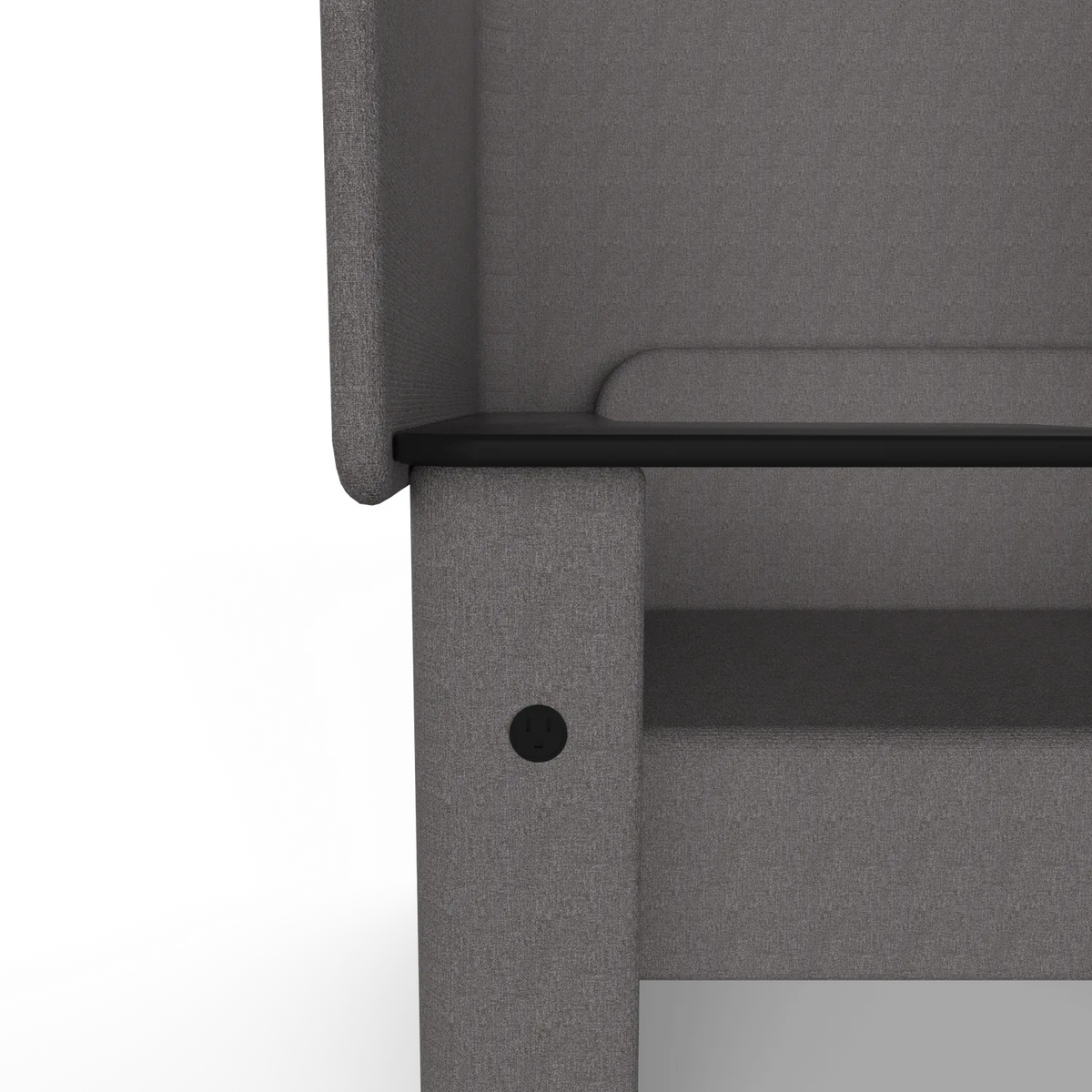 Close-up of the Solo Wing Chair side panel: a round US outlet set into the fabric under the tablet arm