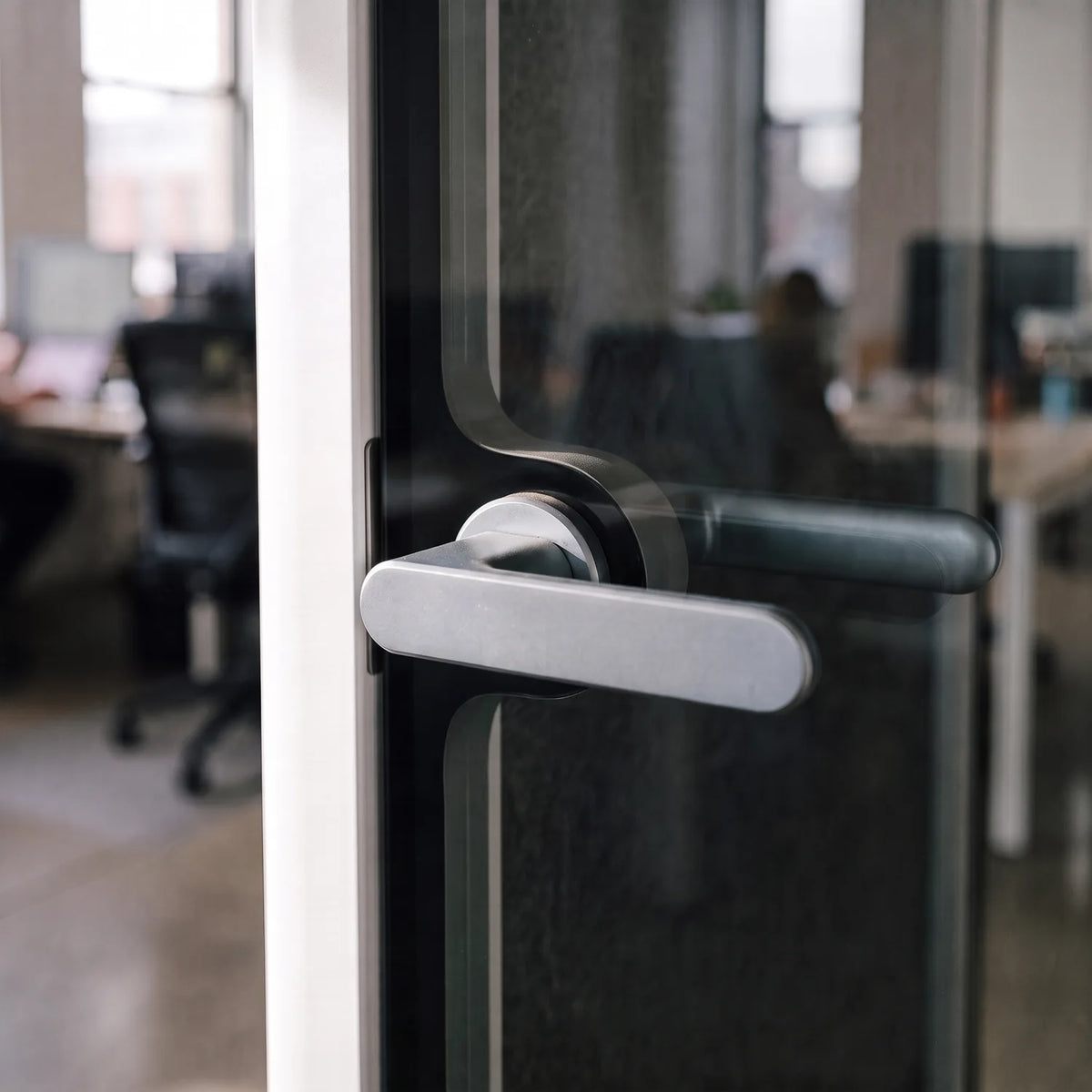 PrivacyPod S Pod brushed metal door handle on the glass door