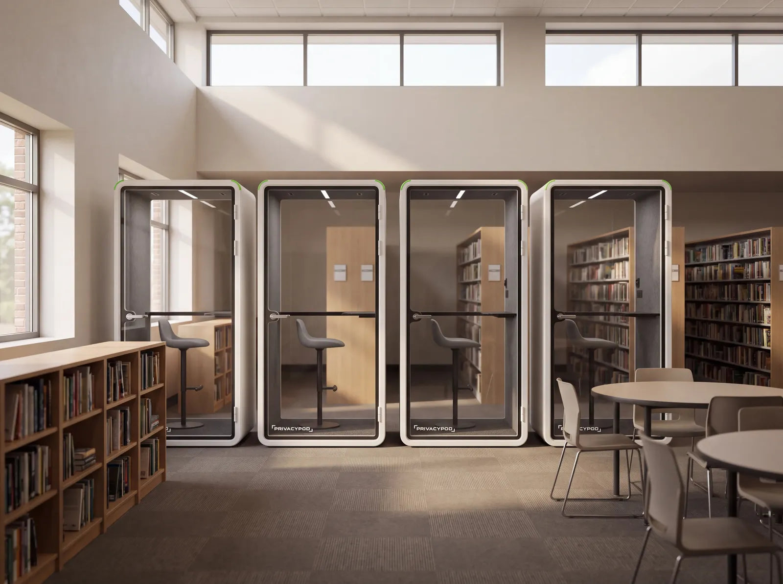 Render of four PrivacyPod S Pods in a row in a school library
